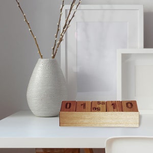 Natural wooden block perpetual calendar.