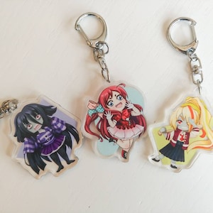 Reversible Zombieland Saga Anime Chibi Acrylic Keychains (Saki, Sakura, Tae)