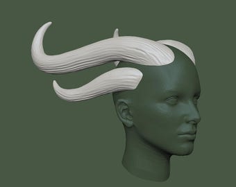 May include: A 3D model of a head with a pair of white horns sculpted on top. The horns are curved and have a textured surface.