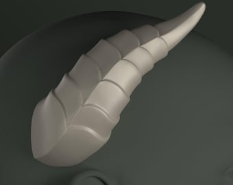 May include: A light gray, textured, sculpted horn with a pointed tip. The horn has a series of ridges that run along its length, giving it a scaly appearance.