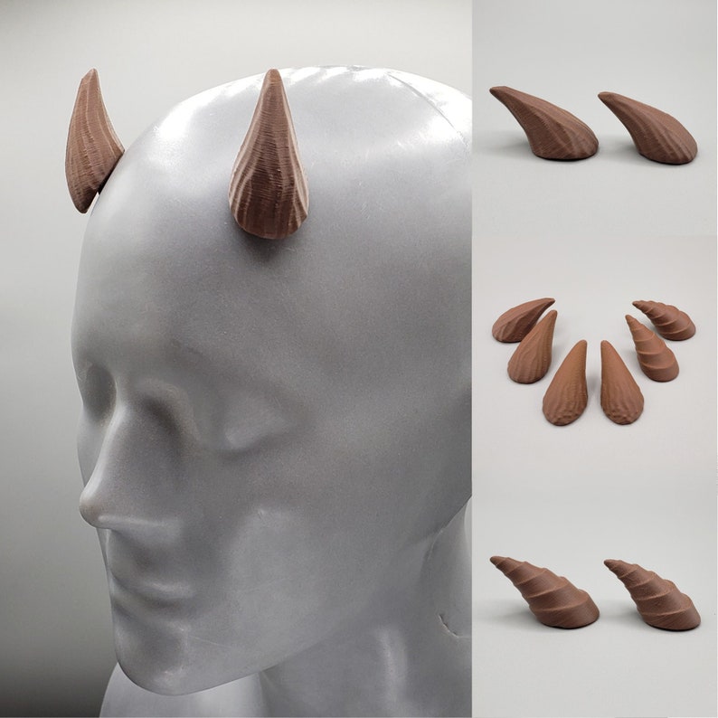 May include: A set of six brown, 3D printed, horn-shaped accessories. The horns are arranged in two groups of three. The horns are displayed on a white surface.