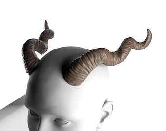 May include: A white mannequin head with two brown, curled horns attached to the top.