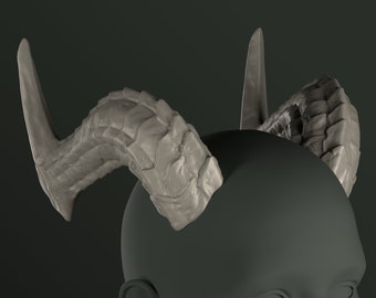 May include: A pair of gray, textured, sculpted horns. The horns are curved and have a pointed tip. They are attached to a gray, smooth surface.