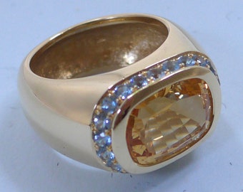 Anillo de oro macizo de 18 quilates engastado con un citrino facetado y engaste pavé de piedras preciosas aguamarina.