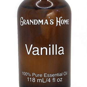 May include: A brown glass bottle with a black lid, labelled "Grandma's Home Vanilla 100% Pure Essential Oil 118 ml/4 fl oz".