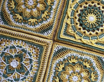 May include: Four square crochet pieces in shades of yellow, green, and white. Each square features a different floral or geometric design. The crochet work is detailed, with visible stitches and intricate patterns. The squares are arranged together.
