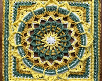 May include: A square, handmade crochet piece featuring a floral design. The piece uses yellow, green, and white yarn. The center is a white starburst, surrounded by a green floral pattern. The outer edges are yellow and green, creating a vibrant, textured textile.