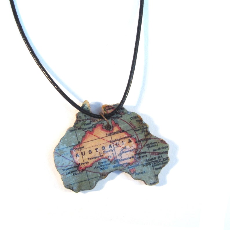 Lasercutted wooden world map necklace. image 9