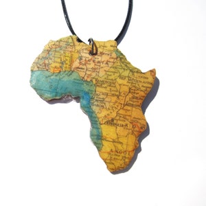 Lasercutted wooden world map necklace. image 7