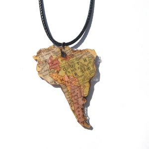 Lasercutted wooden world map necklace. image 2