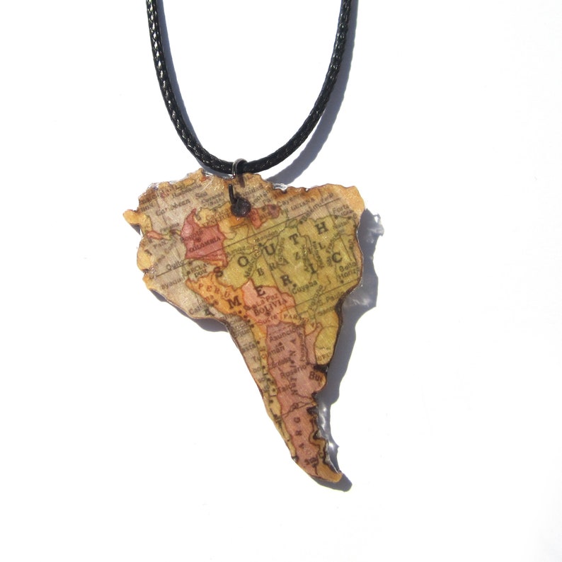 Lasercutted wooden world map necklace. image 2