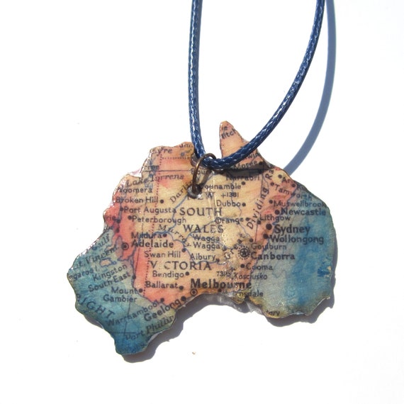 Lasercut wooden world map necklace.