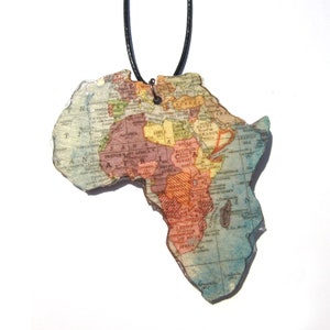 Lasercutted wooden world map necklace. image 8