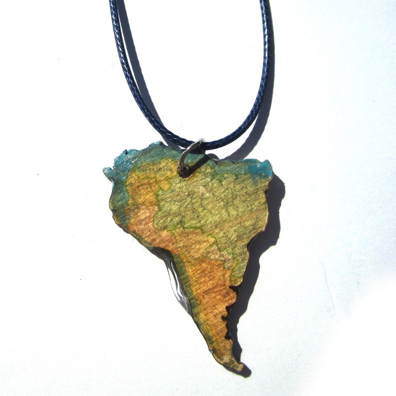 Lasercutted wooden world map necklace. image 3