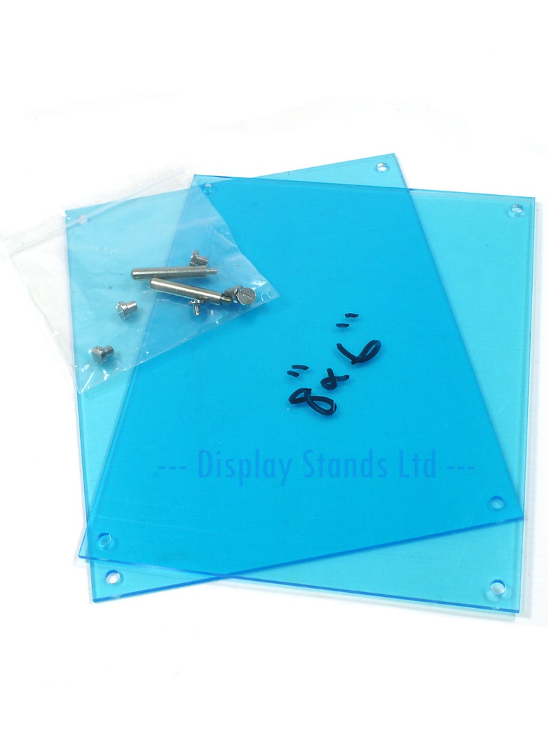 May include: Two clear blue acrylic display stands with holes in the corners. A small bag of hardware is included. The stands are labeled "Display Stands Ltd."