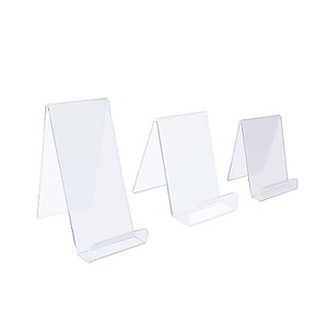 May include: Three clear acrylic bookends of different sizes. The bookends are angled and have a small lip at the bottom to hold books or other items.