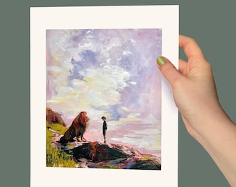 May include: An art print featuring a painting of a lion and a person standing on a rocky landscape under a cloudy sky. The lion has a brown mane and is facing the person. The person is wearing dark clothing.