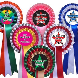 Customised rosettes and badges for all occasions. choose your personalised message for the rosette centre. your choice of ribbon colours