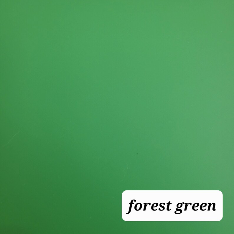 May include: A solid forest green background.