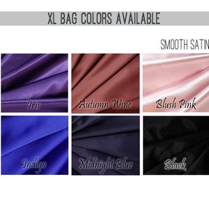 May include: Image showcasing six fabric swatches in various colors, including Iris, Autumn Wine, Blush Pink, Indigo, Midnight Blue, and Black. The text "XL BAG COLORS AVAILABLE" and "SMOOTH SATIN" are displayed at the top of the image.