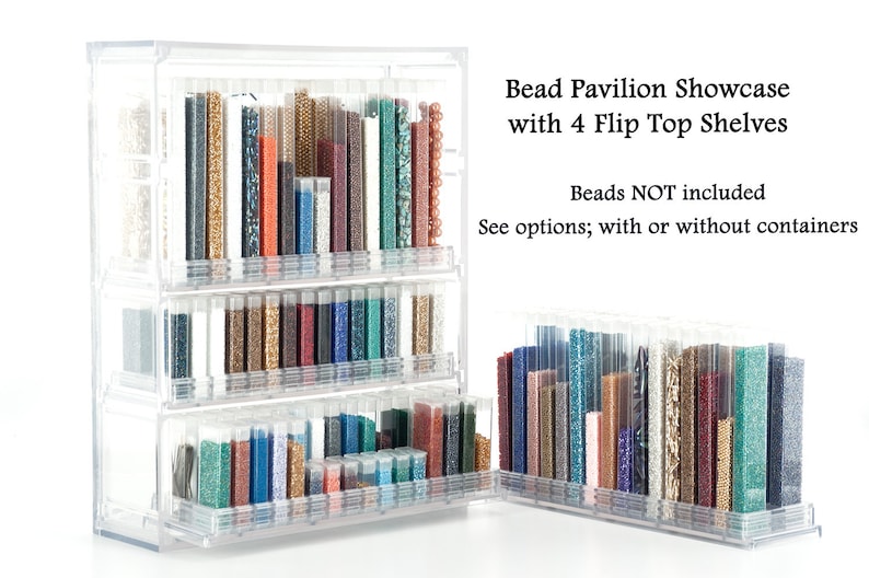 May include: Clear plastic bead storage organizer with four flip-top shelves. The organizer is filled with small containers of colorful beads. "Bead Pavilion Showcase with 4 Flip Top Shelves" and "Beads NOT included" are written on the organizer. "See options; with or without containers" is also written on the organizer.
