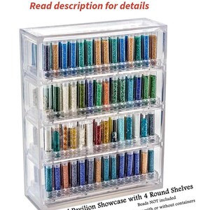 May include: Clear plastic bead storage organizer with four shelves. The organizer is filled with small glass tubes of colorful beads. The text on the bottom reads "Bead Pavilion Showcase with 4 Round Shelves. Beads NOT included. See options; with or without containers."