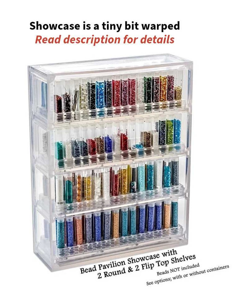May include: Clear plastic bead storage organizer with four shelves. The organizer has two round shelves and two flip-top shelves. The shelves are filled with small glass vials of colorful beads. "Bead Pavilion Showcase with 2 Round & 2 Flip Top Shelves. Beads NOT included. See options; with or without containers." is printed on the bottom of the organizer.