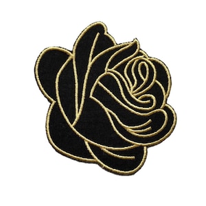 May include: Black embroidered rose patch with gold outline. The rose is a classic symbol of love and beauty.