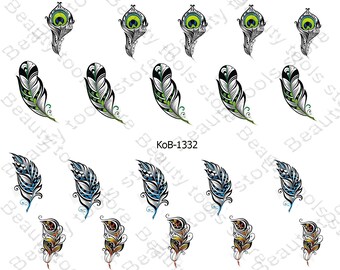May include: A sheet of 12 nail decals featuring peacock feather designs. The decals are in various colors, including black, white, green, blue, and gold.