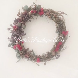 Handmade Australian native dried flower wreath featuring eucalyptus gum nuts, and bottlebrush. Available with fresh or dried flowers