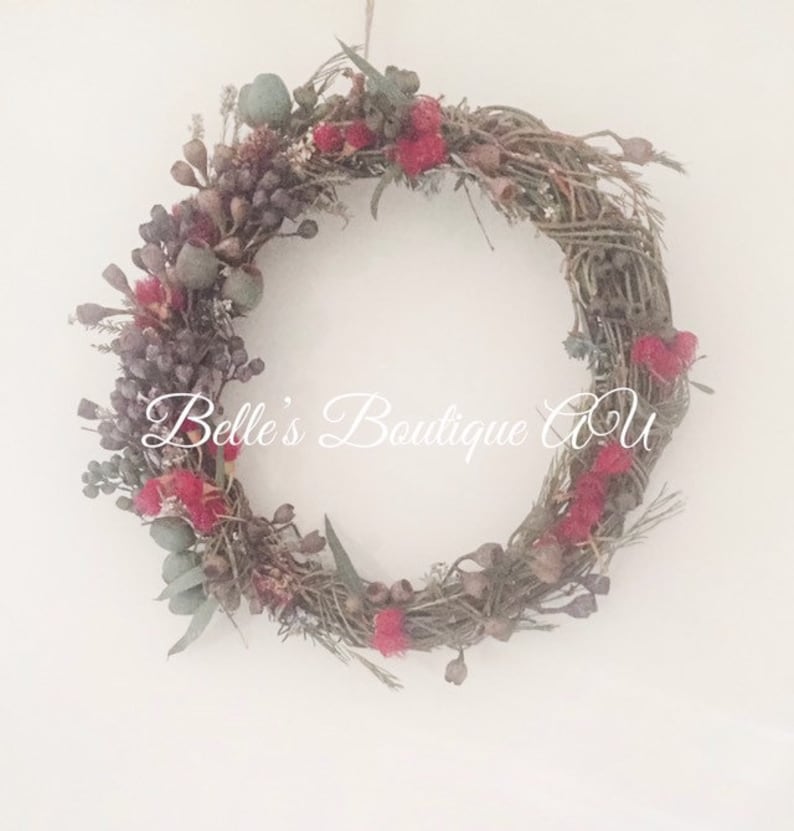 Handmade Australian native dried flower wreath featuring eucalyptus gum nuts, and bottlebrush. Available with fresh or dried flowers
