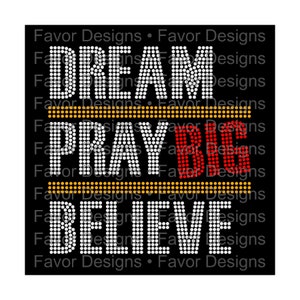 May include: Rhinestone design with the words "Dream", "Pray Big", and "Believe" in white, red, and gold. The words are set against a black background.
