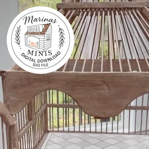 May include: A decorative, wooden birdcage with a distressed finish. The cage features a domed top and a diamond-patterned floor. The image includes a circular logo with the text "Marinas Minis Digital Download SVG File".