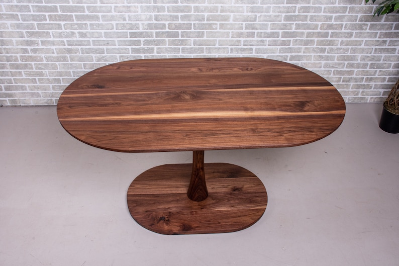 narrow kitchen table made with walnut on pedestal base