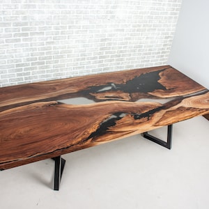 epoxy dining table made with walnut and clear resin