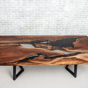epoxy dining table made with walnut and clear resin