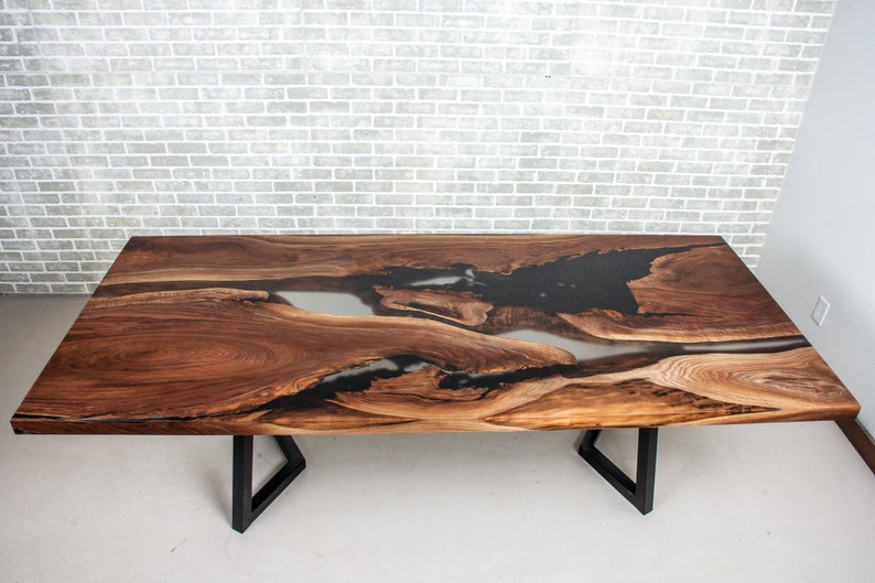 epoxy dining table made with walnut and clear resin