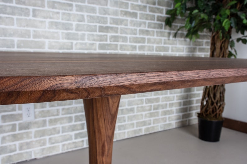 kitchen table made with walnut on pedestal base