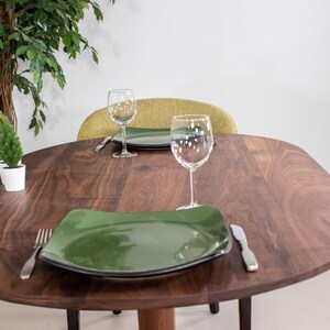 kitchen table made with walnut on pedestal base