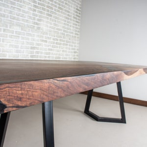 epoxy dining table made with walnut and clear resin