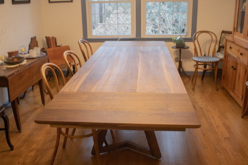 large walnut extendable table on walnut legs