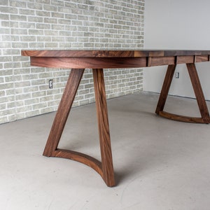 solid walnut oval table with leaves on wood curved legs