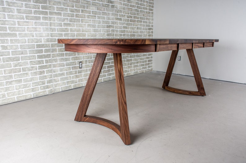 solid walnut oval table with leaves on wood curved legs