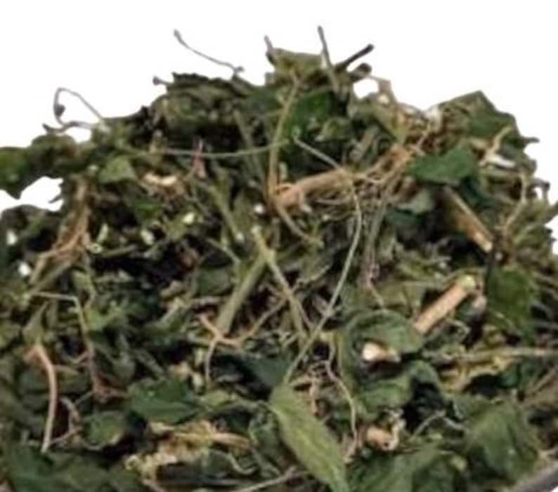 May include: Dried green herbs and roots, likely used for medicinal purposes or in herbal teas.