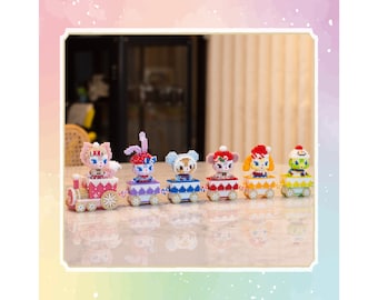 May include: A colourful train with six carriages, each featuring a different animal character. The train is made of plastic and has a whimsical design. The characters are a cat, a rabbit, a bear, a fox, a bird, and a frog.
