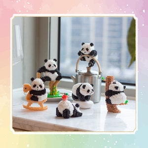 May include: A collection of six black and white panda figurines. The pandas are in various poses, including sitting, standing, and climbing a tree. The figurines are made of a white material and have black eyes, noses, and mouths. The figurines are on a white surface.