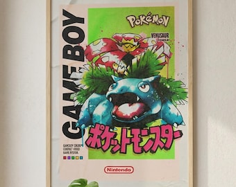 May include: A framed poster with a retro Pokémon design, featuring the text "GAME BOY" and Japanese characters. The poster displays a blue and green Venusaur illustration with the Nintendo logo. The poster is displayed in a living room setting.