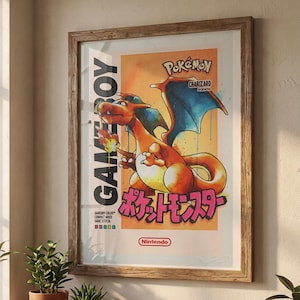 May include: Framed poster featuring Charizard from Pokémon, with the text "GAME BOY" and Japanese text. The artwork has a retro aesthetic with orange, blue, and yellow hues. The Nintendo logo is at the bottom.