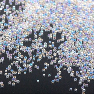 50g / 100g Beutel Nail Art 0,6-1,0mm Glas Keine Loch Perlen Mini Transparent AB Kaviar Elfen Perlen Kristall glänzende kleine Perlen