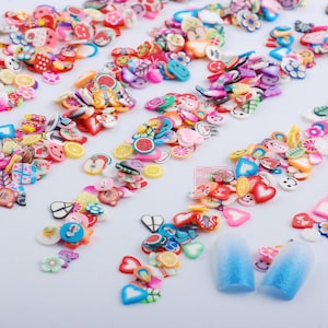 May include: Assortment of colorful nail art charms in various shapes, including hearts, stars, flowers, and smiley faces. The charms are made of polymer clay and are perfect for adding a touch of whimsy to your nails.